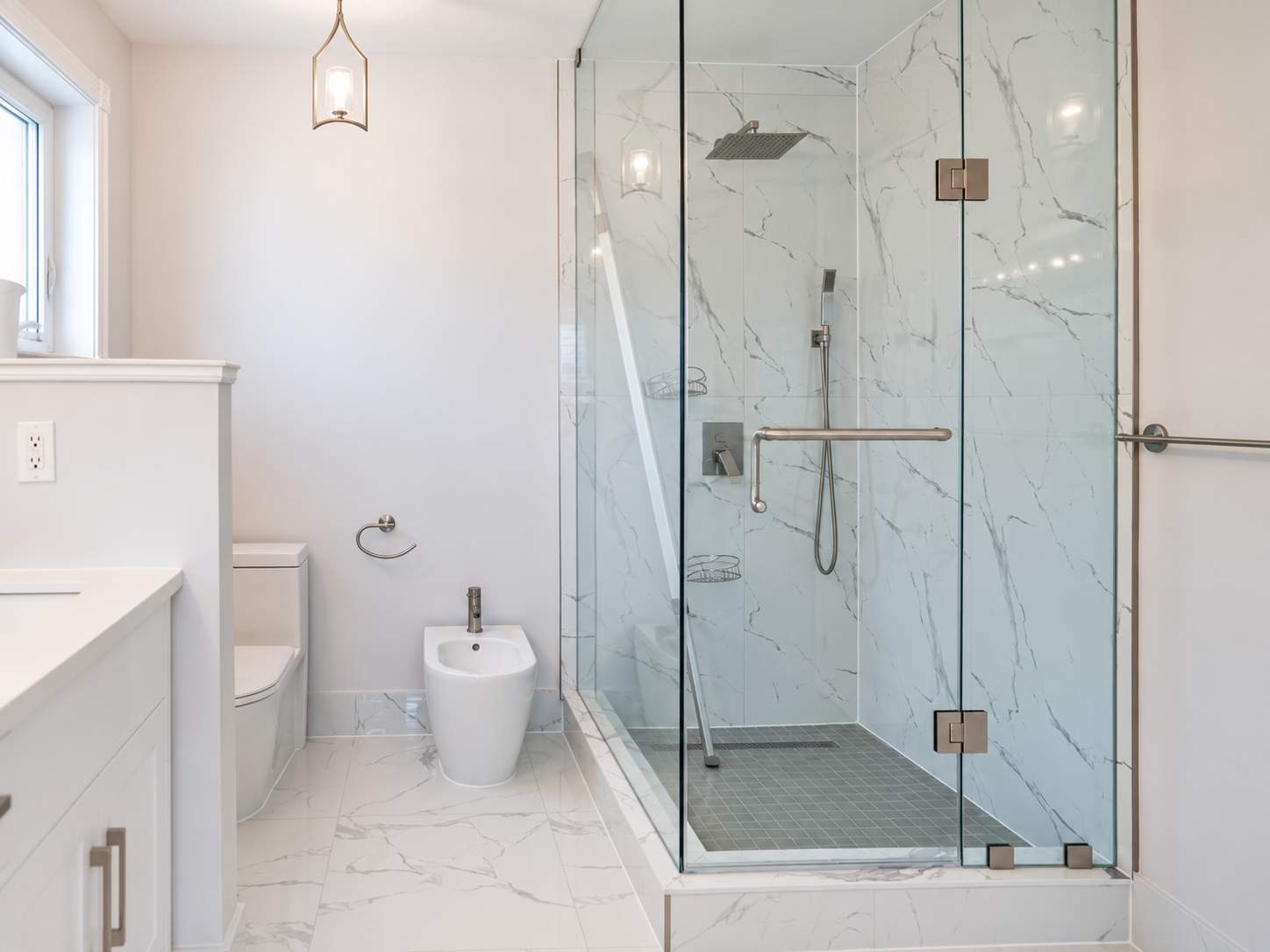 Detail study of the frameless glass shower and aligned marble-look tile